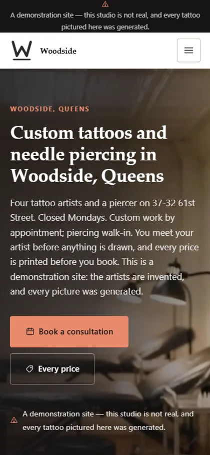 The tattoo studio demo website on a phone screen